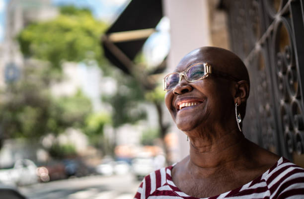 istock Happy senior woman outdoors looking away 1284595565