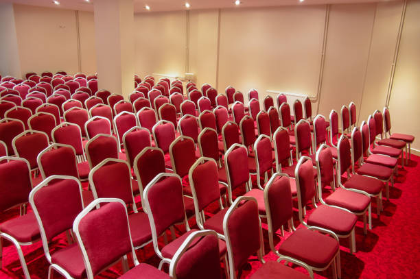 istock Conference room with red chairs in a row 1284596756