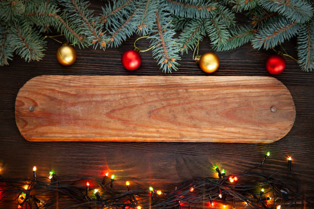 istock Christmas Tree and decorations on wooden background 1284597251
