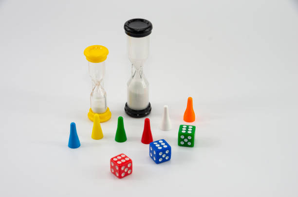 istock Game colored dice with an hourglass on white background 1284600669