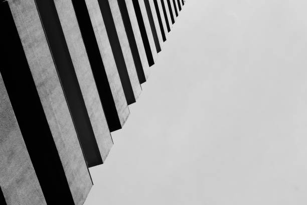 An abstract view looking at a modern concrete building. Artistic view of exterior architectural design and details. A modern building.