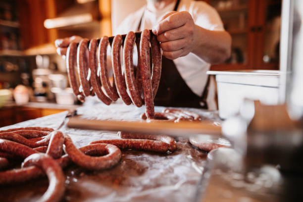 istock Mature holding his own german sausages at home ready for the maturation process 1284602511