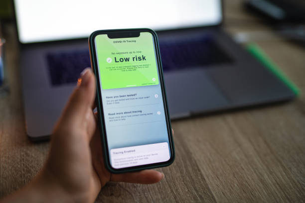 istock Woman checking Covid 19 tracing app status 1284607021