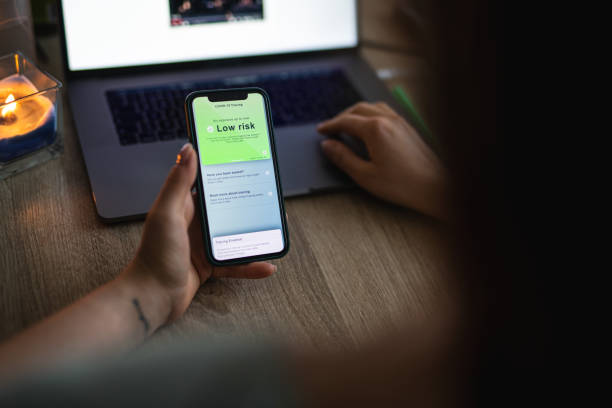 istock Woman checking Covid 19 tracing app status 1284607052