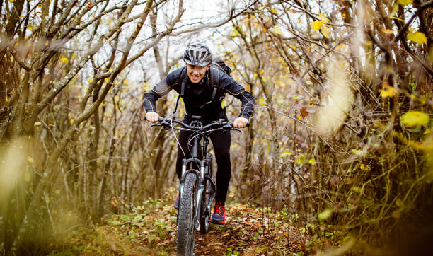 istock Man cycling in the forest 1284607058