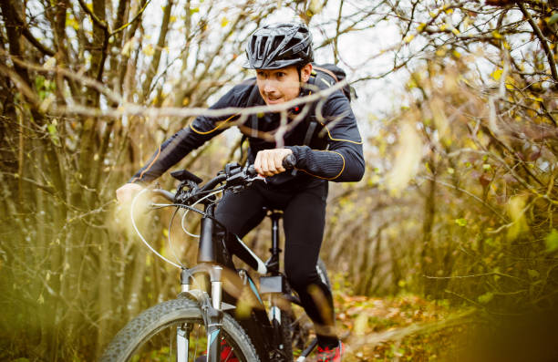 istock Man cycling in the forest 1284607589