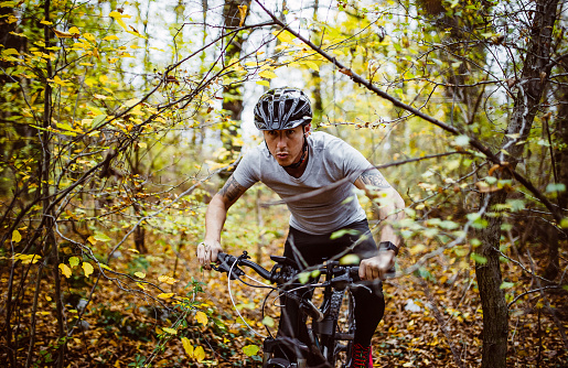 Man cycling in the forest