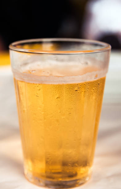 istock glass of light beer on typical brazilian cup (americano long drink) 1284607712
