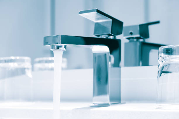 istock Luxury modern style faucet on a white sink in a beautiful bathroom 1284608639