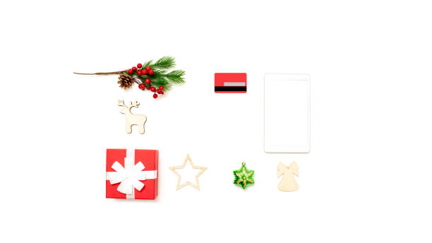 istock Wide banner with digital tablet with copy space top view on white table, credit card, present box and christmas toys 1284615469