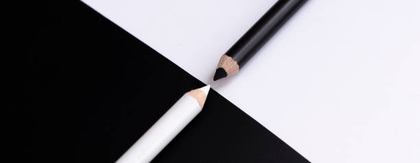 istock white and black pencils on white and black background. abstraction 1284615679