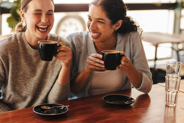 istock Female friends enjoying a coffee at cafe 1284616615