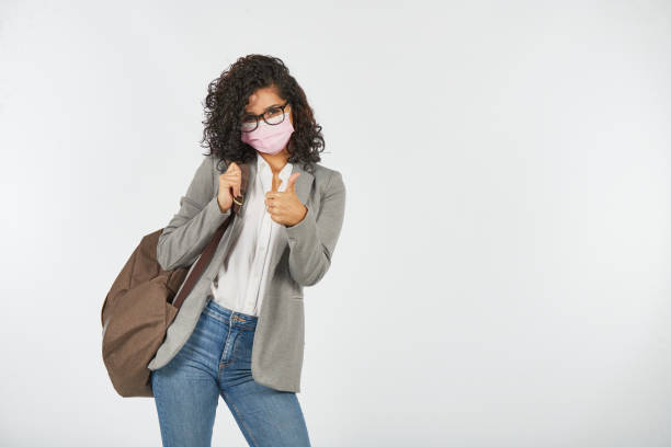 istock University student ready to study with a mask due to the covid-19 pandemic 1284619310