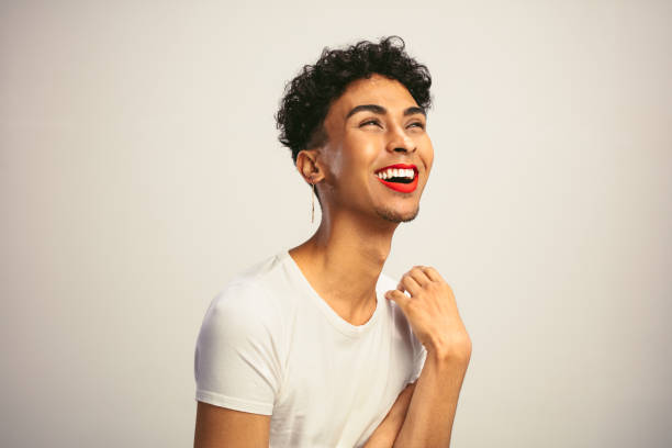 istock Transgender man with makeup laughing 1284620446