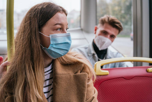 istock People wearing a mask and using public transport 1284620641