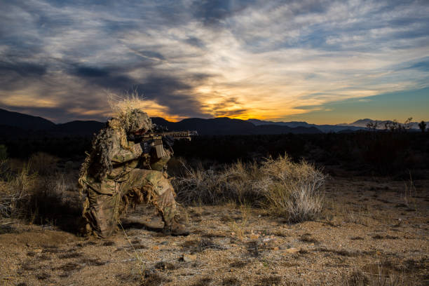 istock Sniper Desert Gillie Suit Rifle 1284621695