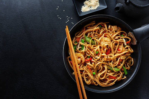 istock Asian noodles with shrimps and vegetables 1284622382