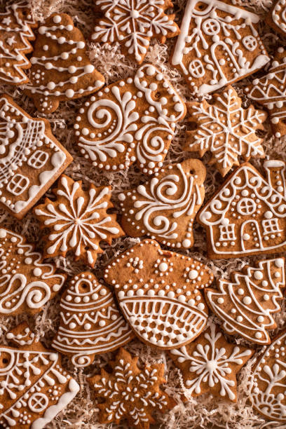 Christmas gingerbread cookies on holiday packaging. Homemade cookies. Freshly baked Christmas cookies background. christmas cookies pattern stock pictures, royalty-free photos & images