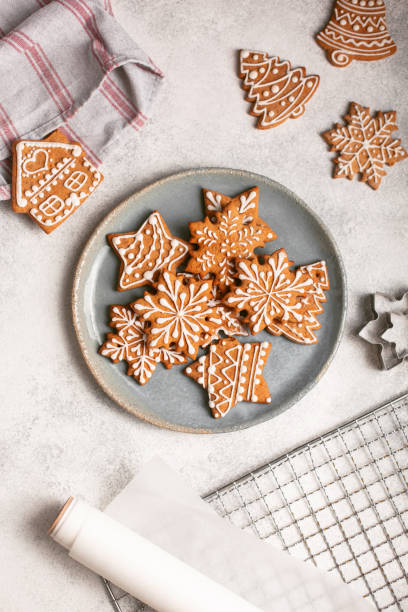 istock Gingerbread cookies on plate on concrete background 1284622404