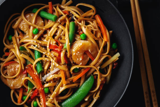 istock Asian noodles with shrimps and vegetables 1284622469