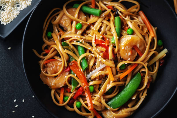 istock Asian noodles with shrimps and vegetables 1284623017