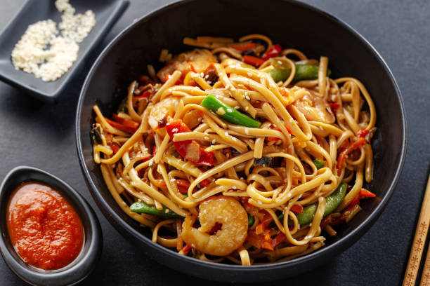 istock Asian noodles with shrimps and vegetables 1284623131