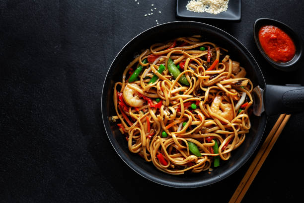 istock Asian noodles with shrimps and vegetables 1284623141