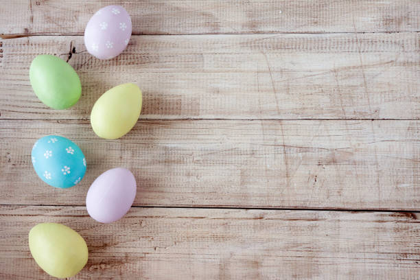 istock Colorful easter eggs in basket on wooden table. Happy easter. Top view with copy space. Orthodox holiday. 1284624735