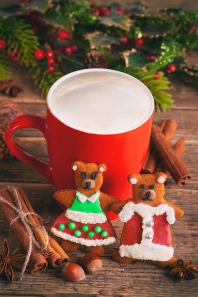 istock Christmas cappuccino and gingerbread cookies in front Christmas tree 1284625735