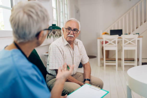 istock Senior man is having a conversation with the nurse during a health checkup 1284626621