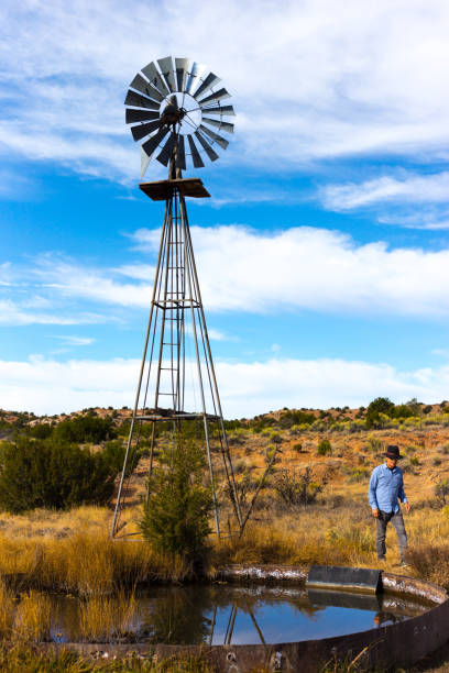 Rancher at Southwest USA Desert Ranch Windmill