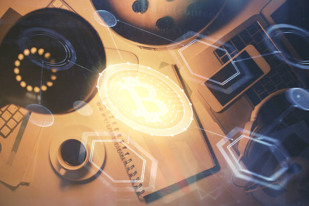istock Multi exposure of crypto theme drawing and work table top veiw. Concept of blockchain technology in business. 1284629799