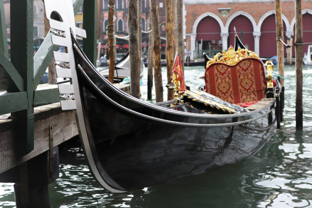 istock Black gondola Venice on the water without people 1284630979