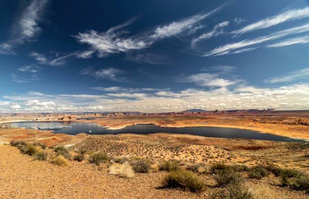 istock From a dry desert to a river to clouds and a distant snow capped mountain makes up a beautiful landscape, Wahweap lookout, Page, AZ 1284634948