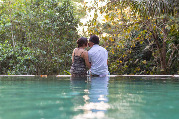 istock Happy couple kiss while on vacation in Bali 1284635773