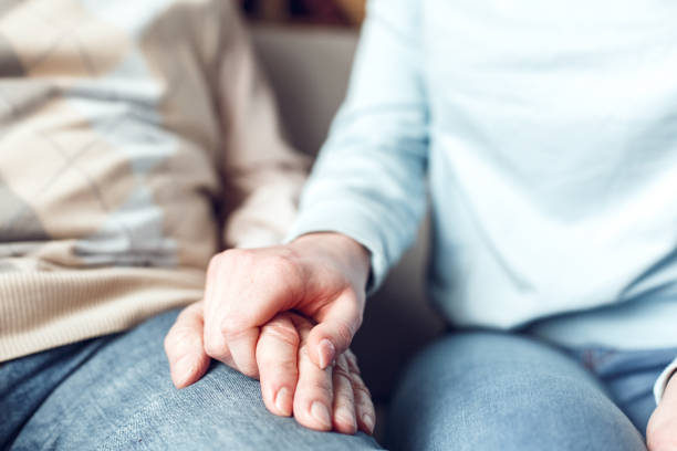 istock Father and daughter at home library sitting holding hands supportive 1284635847