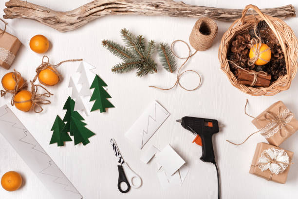 istock DIY Christmas home decor from natural materials. Elements for making garlands paper, cones, twine 1284636306