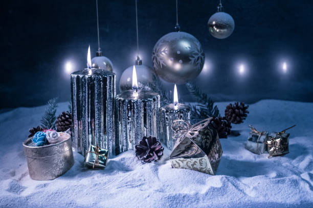 istock Creative artwork decoration. Christmas decoration with burning candles on a dark background. Christmas ornaments over dark golden background with lights. 1284641780