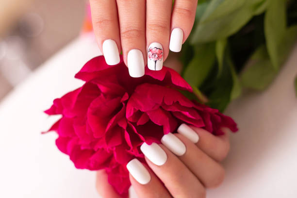 istock Beautiful female hands with romantic manicure nails 1284649627