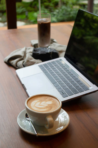 istock Hot coffee and iced coffee on wooden table 1284651285