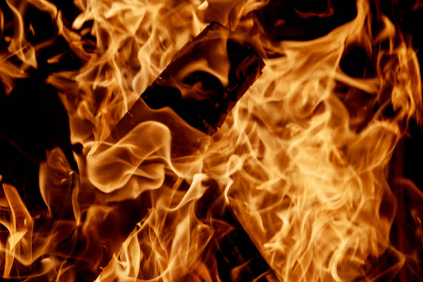 Beautiful fire burning in fireplace full of wood fire flame over the wooden logs