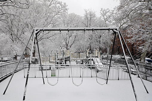 Spring snowstorm in New York City, playground