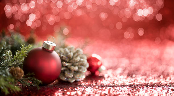 istock Christmas Red Baubles on a Red Background 1284662289