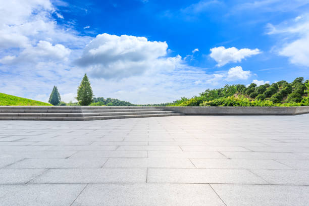 Empty square floor and green tea plantations with mountain natural scenery.