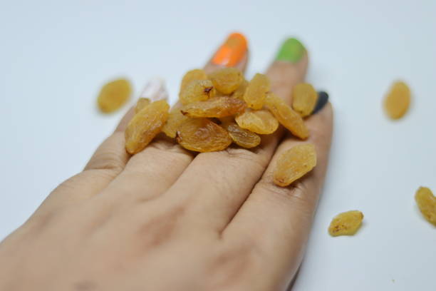 istock Yellow sultanas raisins isolated on white background cutout 1284663269