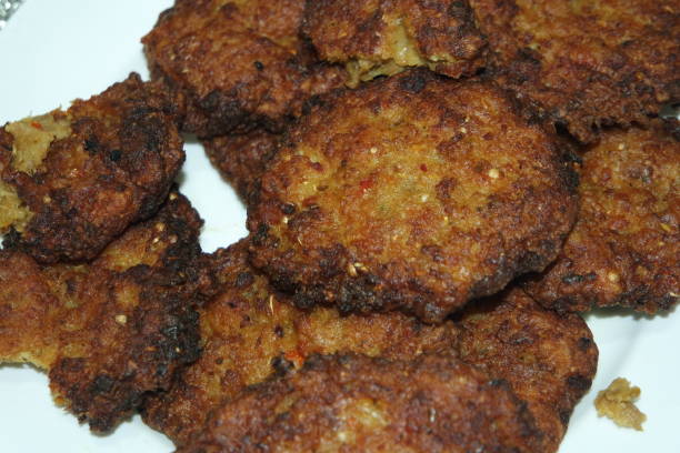 istock Delicious spicy fried round kebab served in white ceramic plate 1284668288