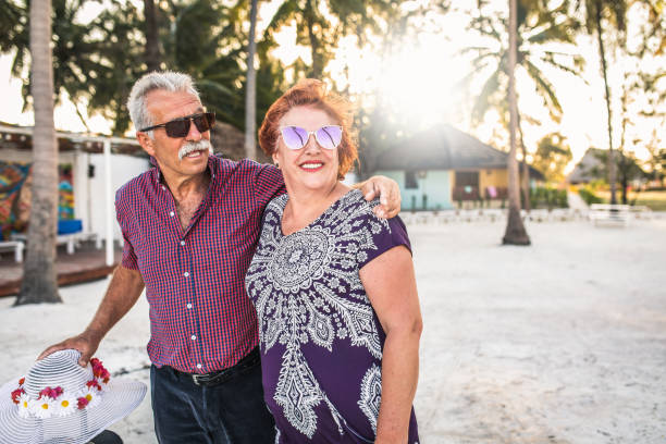 istock Senior couple enjoying their vacation at the beach 1284676265