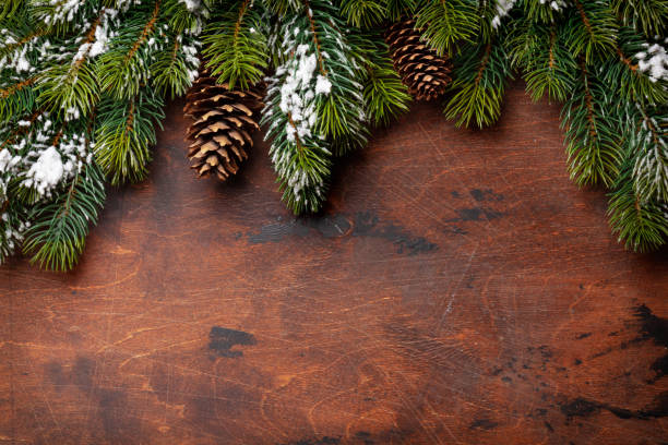 istock Christmas greeting card with fir tree and pine cones 1284676684