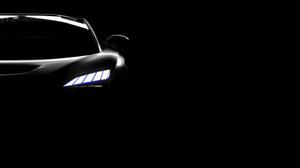 istock black sportscar silhouette on black background 1284676948