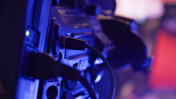 istock Sound and TV engineer working on a mixing panel in a dark room setting for a game event production in Krefeld, Germany. 1284677560